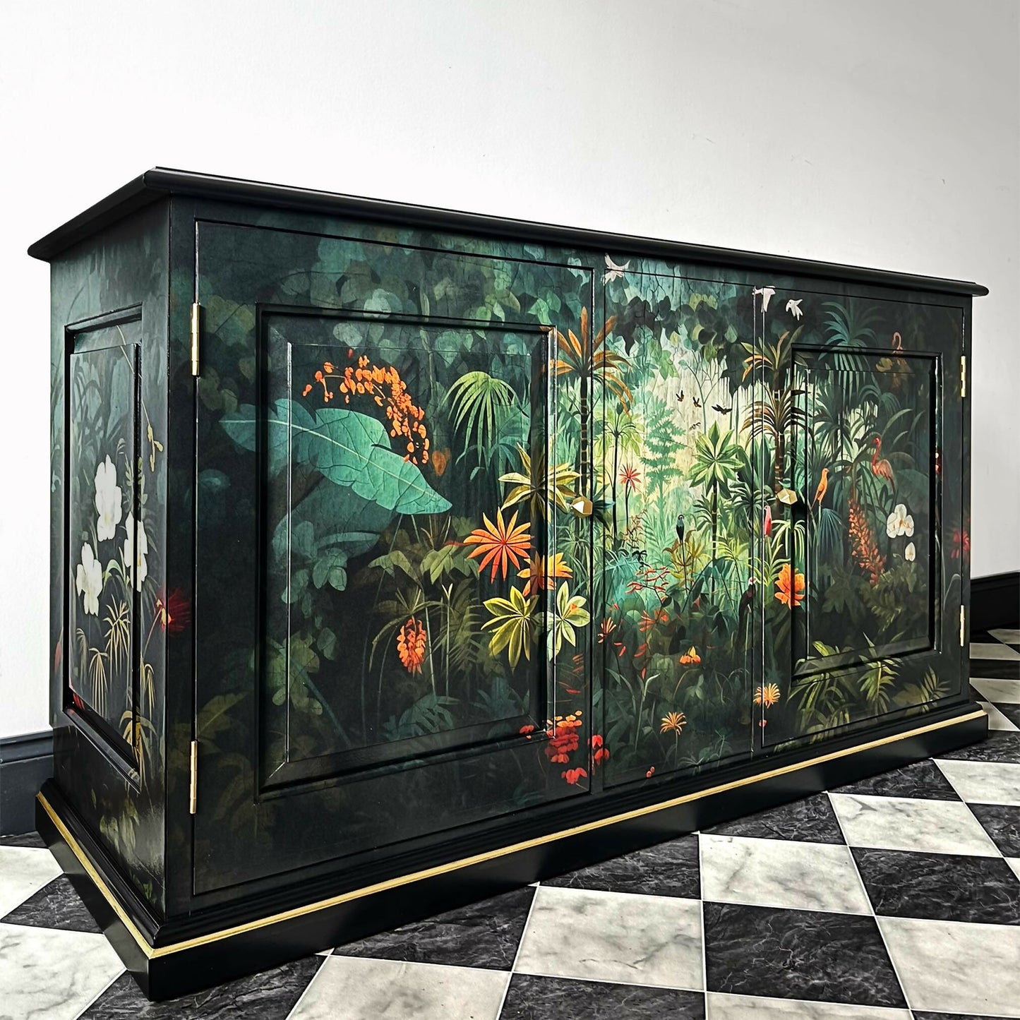 Vintage sideboard TV cabinet painted black and decorated with exotic jungle jungle design in front and sides angle