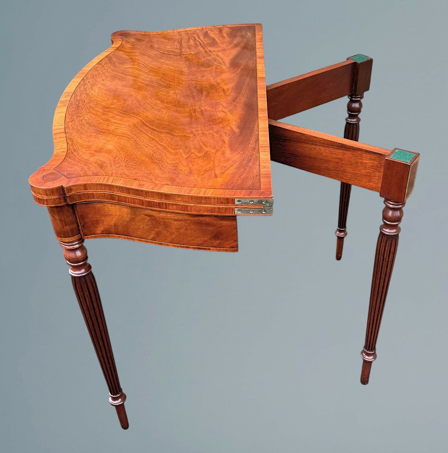 A Mahogany Serpentine Fronted Turn Over Top Tea Table