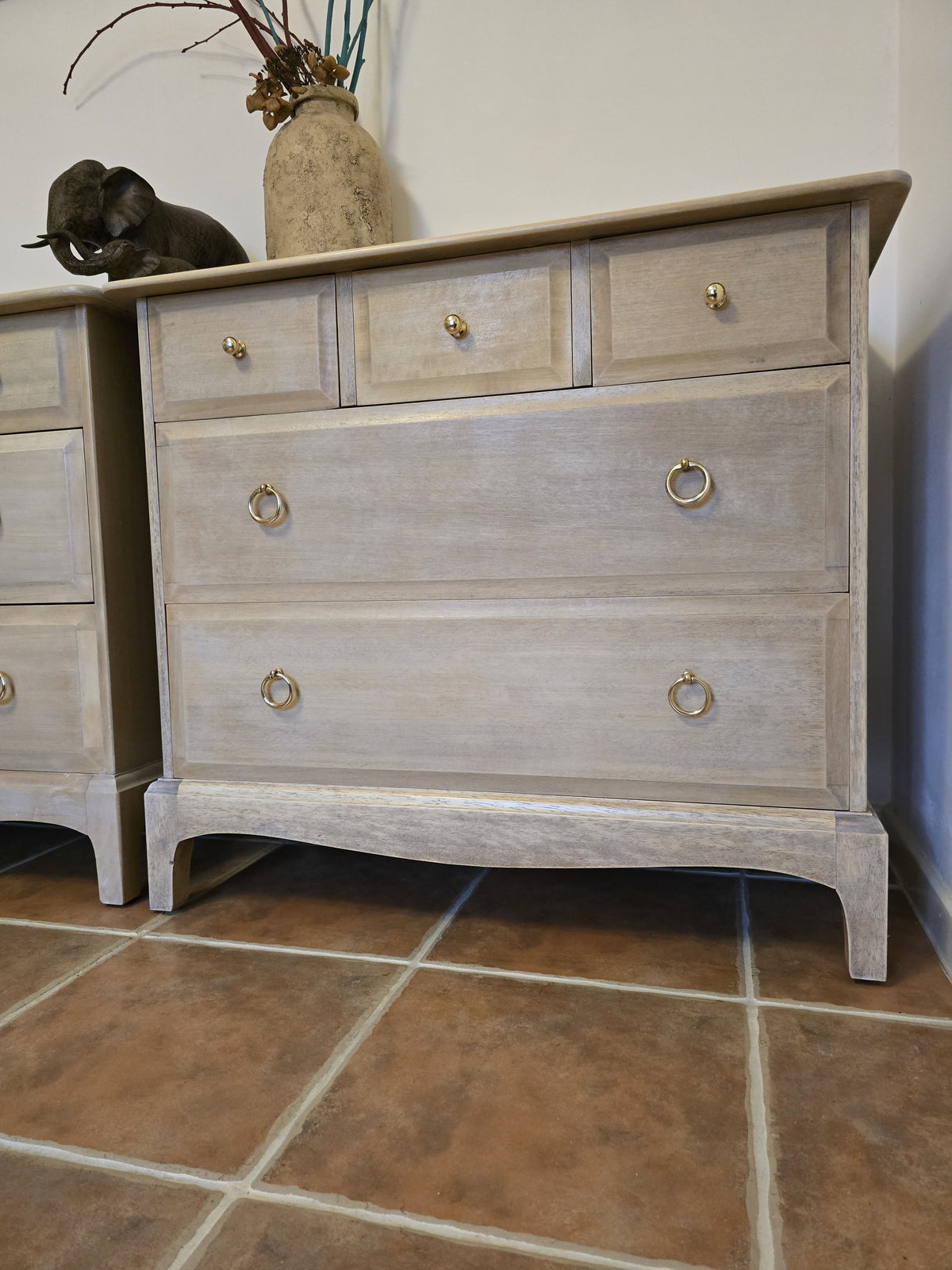 Pair Stag minstrel chest of drawers