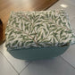Small mid century Ottoman storage and seat. Sage green paint makes you choose the material.