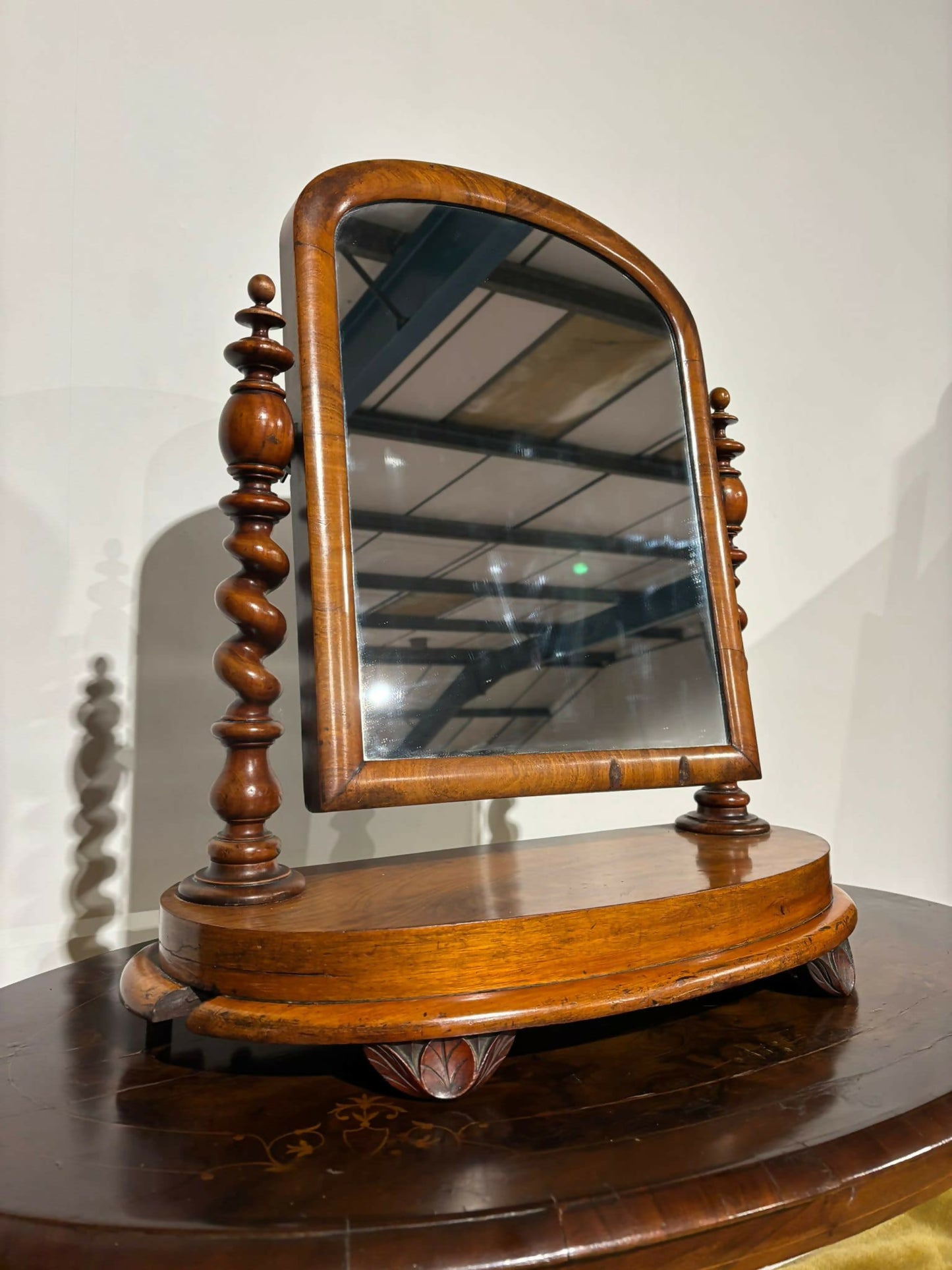 Victorian walnut dressing table mirror, supported on turned carved supports.99