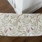 Gold painted mid century Ottoman with new marching cotton fabric top