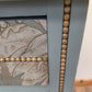 Vintage pale blue and gold drawered cupboard.