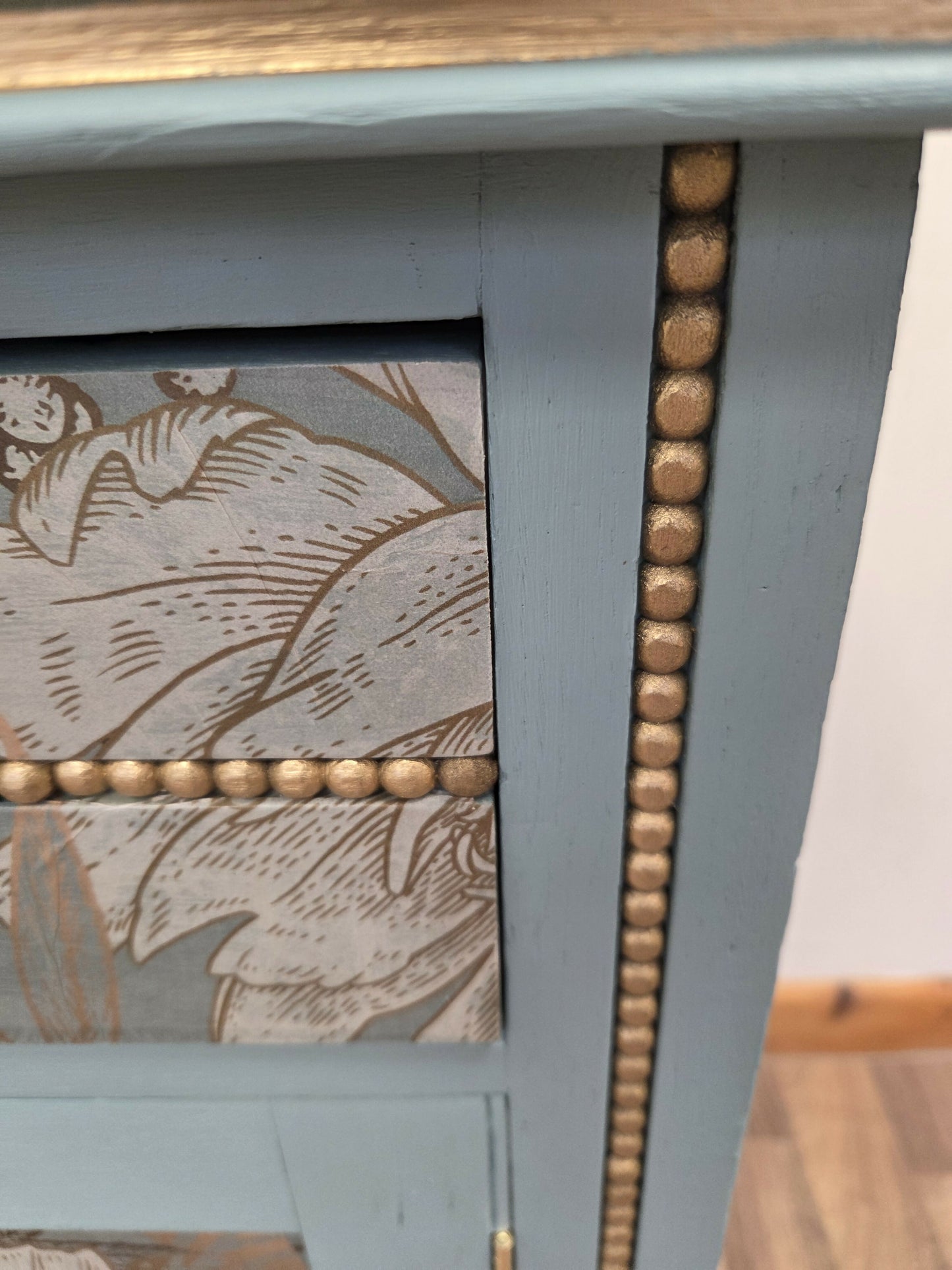 Vintage pale blue and gold drawered cupboard.