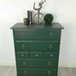 Stag minstrel tallboy chest of drawers in dark green