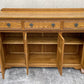 A WOOD BROTHERS OLD CHARM VINTAGE CARVED OAK SIDEBOARD / DRESSER BASE.