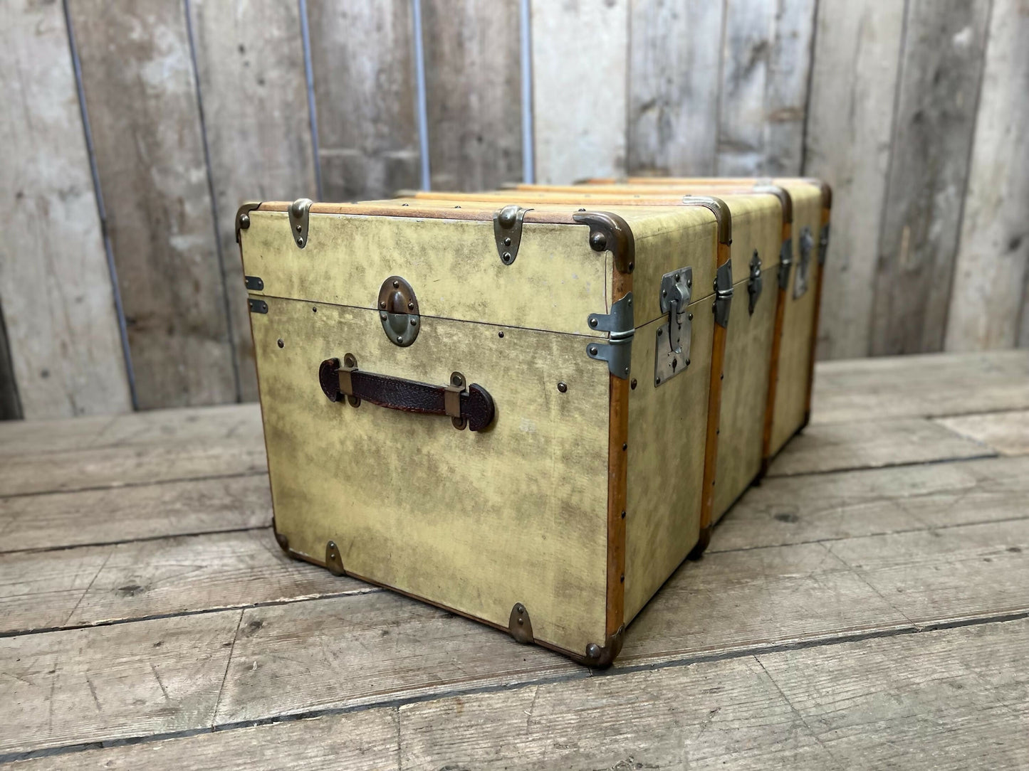 antique beige leather banded travel trunk with keys