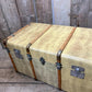 antique beige leather banded travel trunk with keys
