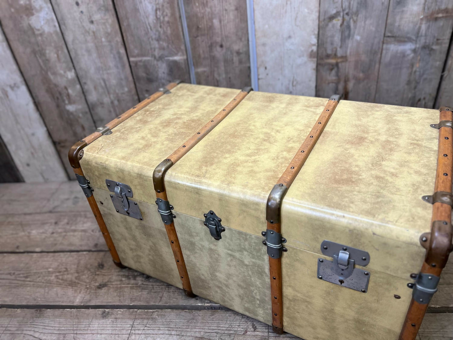 antique beige leather banded travel trunk with keys