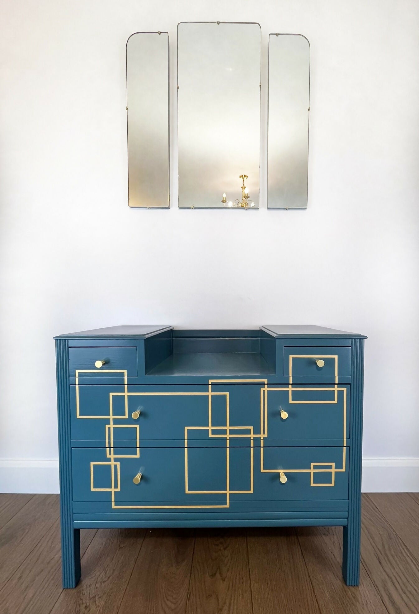 Blue and gold chest of drawers with geometric pattern and original mirrors