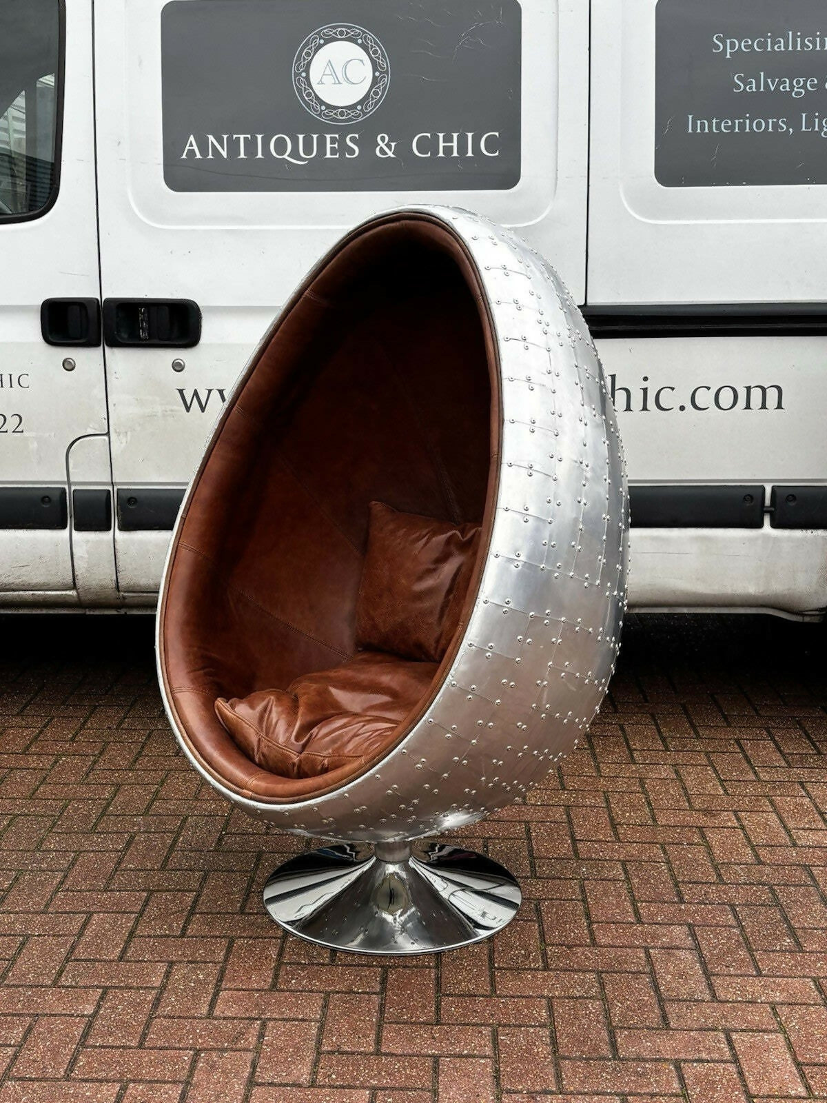 Aviation Swivel Egg Chair With Tan Leather.