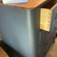 Vintage Harris Lebus 4 Drawer Chest With A Natural Wood Top And Brass Drop Handles.