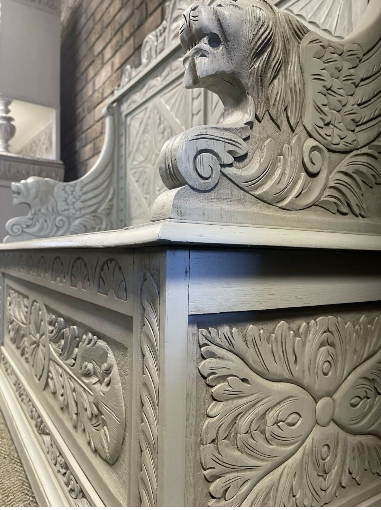 Edwardian antique Settle in solid oak with ornate carvings.