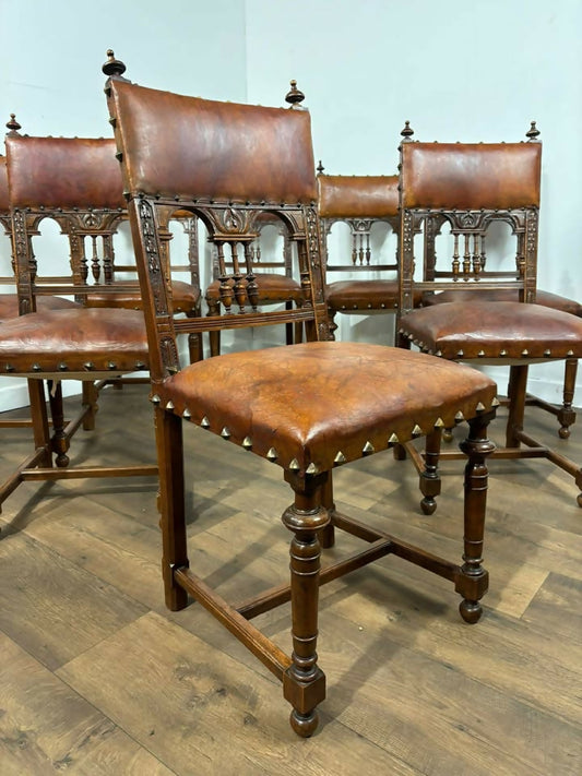 Set of Eight Renaissance Style Oak Dining Chairs with Leather Upholstery
