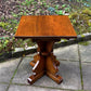 A RUPERT GRIFFITHS MONASTIC CARVED SOLID OAK LAMP TABLE / PLANT STAND