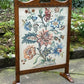 A RUPERT / NIGEL GRIFFITHS MONASTIC CARVED OAK FIRE SCREEN / STAND