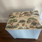 Bijou ottoman seat sky blue with Peter Rabbit themed upholstery. 45cm high 45cm long 30cm deep