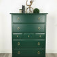 Stag minstrel tallboy chest of drawers in dark green