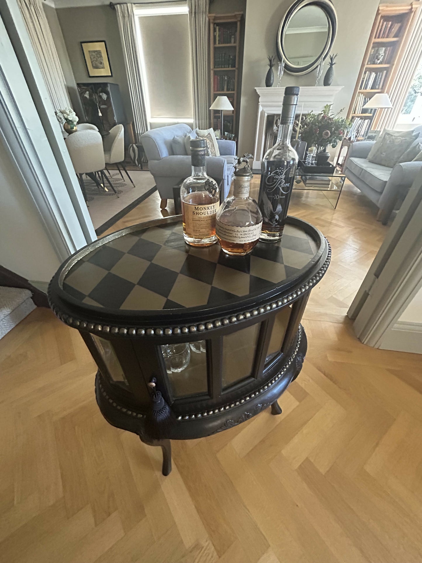 Drinks cabinet. Small, handpainted Black/gold cabinet with harlequin design.