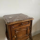 A near pair of antique French walnut and marble bedside tables