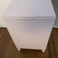 Mauve laundry basket with sage green interior.