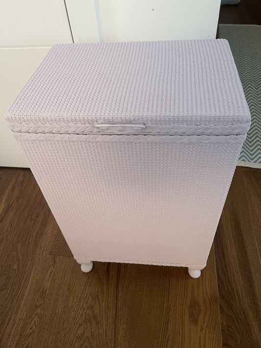 Mauve laundry basket with sage green interior.