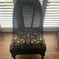 Lloyd loom low accent chair. Black satin paint and William morris style fabric