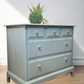 Stag Minstrel Chest of Drawers on Grey, Oversize bedside table