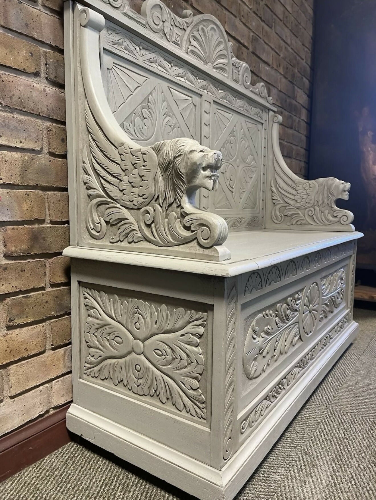 Edwardian antique Settle in solid oak with ornate carvings.