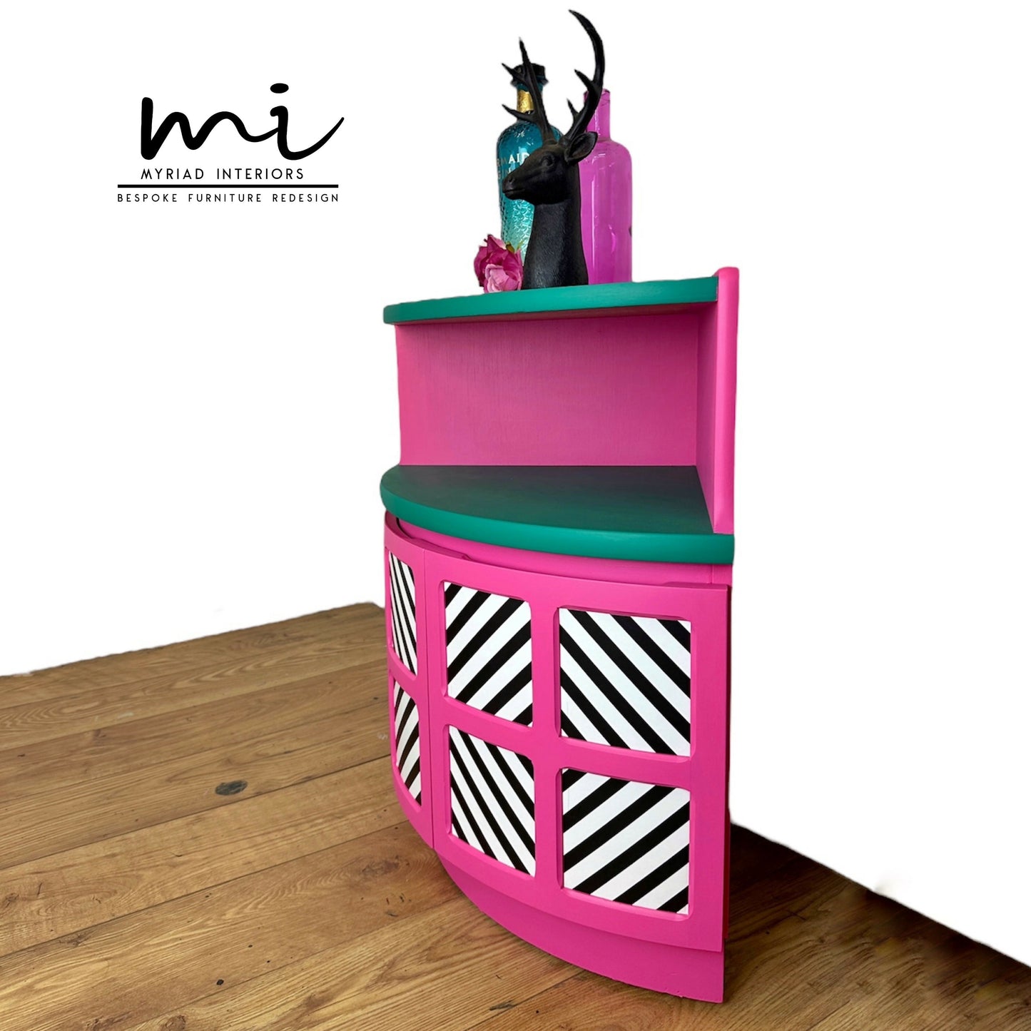 Maximalist hot pink and turquoise Nathan corner cabinet with black and white geometric design, mid century modern, bold, bright, statement