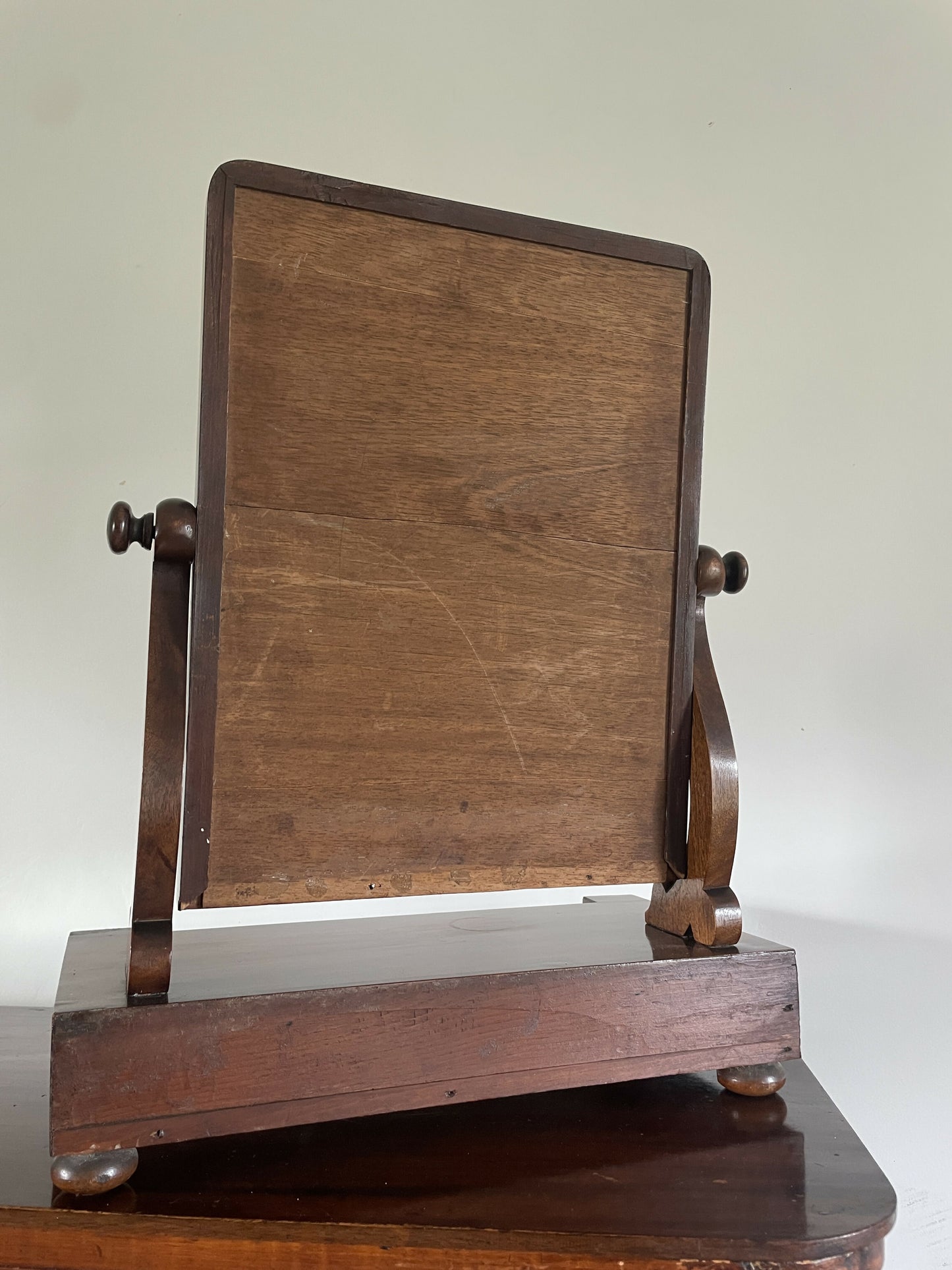 An Antique Victorian mahogany table top mirror