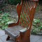A RUPERT / NIGEL GRIFFITHS CARVED OAK DERBYSHIRE WING BACK LEATHER / ARMCHAIR