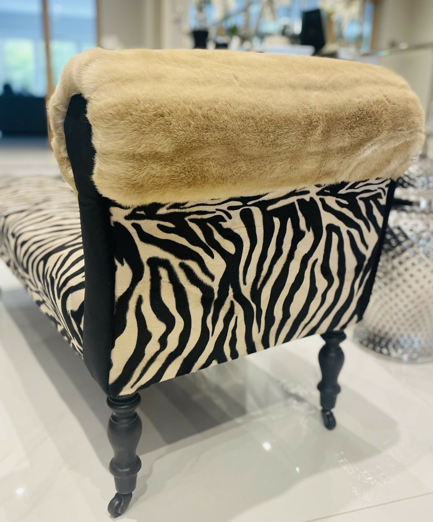 Baby chaise lounge in velvet zebra print and faux mink fur roll top