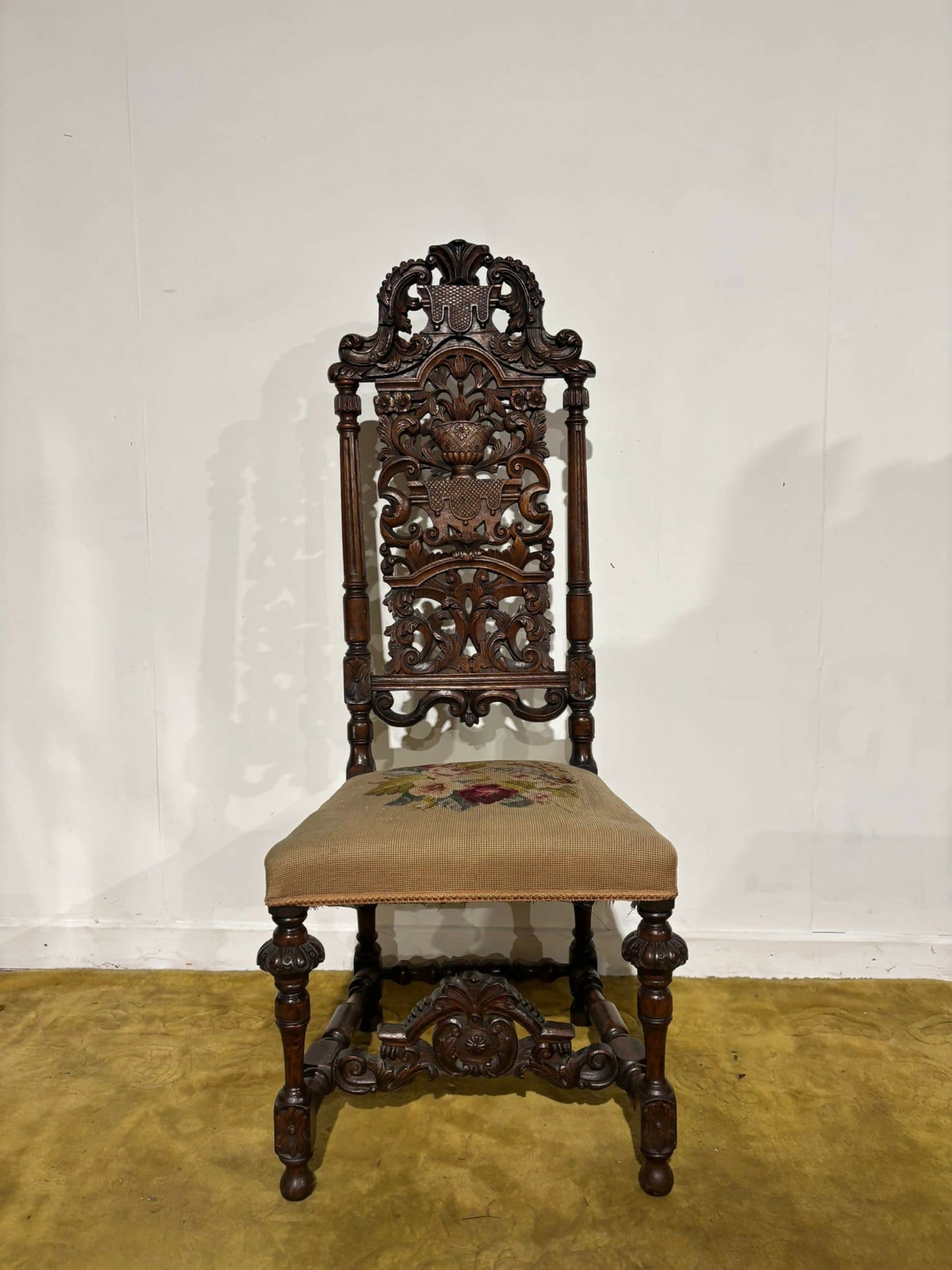 Carolean carved oak high back chair - having a very decoratively carved back, legs66]]