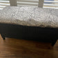 Black satin painted Lloyd loom ottoman. You choose the fabric