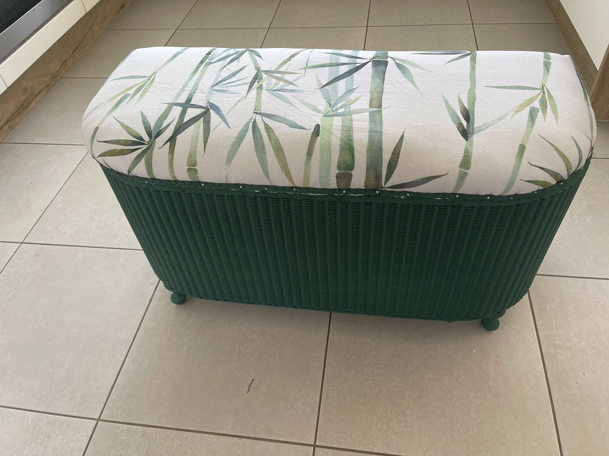 Lloyd loom ottoman. Matt Forest Green paint and matching bamboo motif fabric