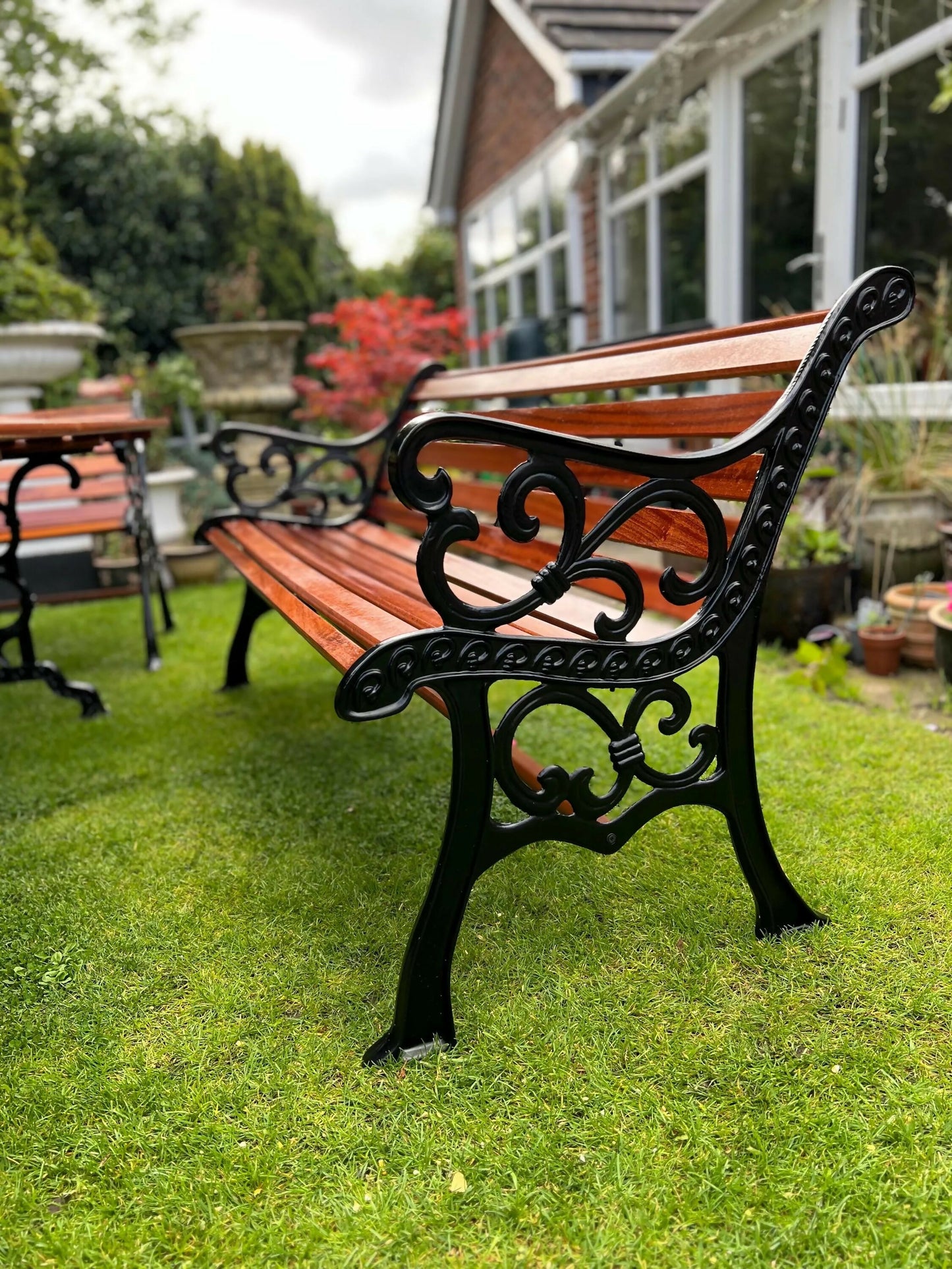 Black Vintage Cast Iron Patio Set adorned with Sapele Wood 3 seater Benches included