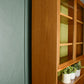 G Plan Sierra Wall Unit with Glass Doors and Green Backboard