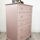 Stag minstrel tallboy chest of drawers in dusky pink