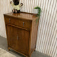 Vintage Art Deco burr walnut veneer cupboard featuring two doors and one drawer.