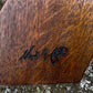 A NIGEL RUPERT GRIFFITHS MONASTIC CARVED OAK LEATHER FIRESIDE CHAIR / ARMCHAIR