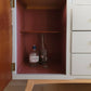 Shebert sideboard bottles in cupboard