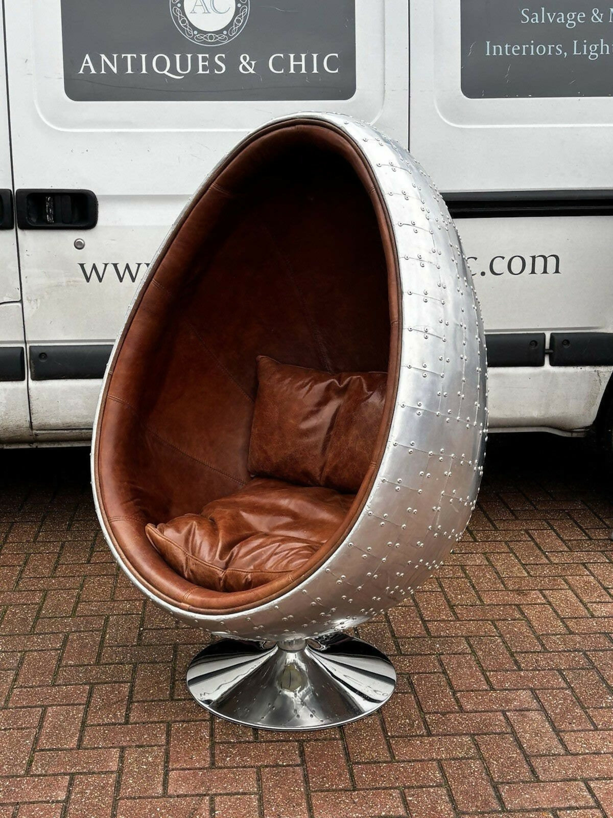 Aviation Swivel Egg Chair With Tan Leather.