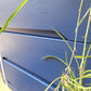 Small Simple Blue Chest Of Drawers With A White Stripe