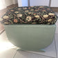 Small mid century Ottoman storage and seat. Sage green paint makes you choose the material.