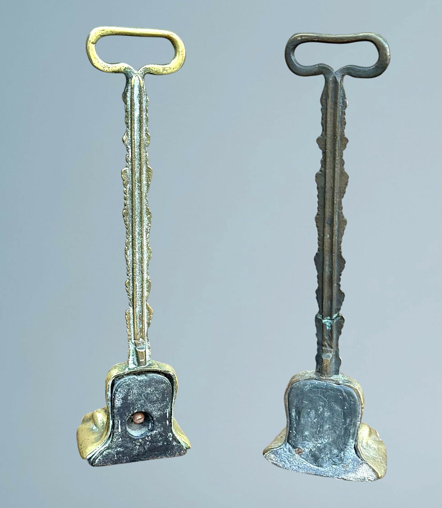 A Near Pair of 19th Century Brass Lion Paw Door Porters