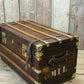 Antique full leather and brass bound travel trunk coffee table