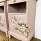Dusky blush pink Stag Minstrel slim tea tray bedside tables with blossom and butterfly design. Nightstands pale pink