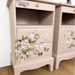 Dusky blush pink Stag Minstrel slim tea tray bedside tables with blossom and butterfly design. Nightstands pale pink