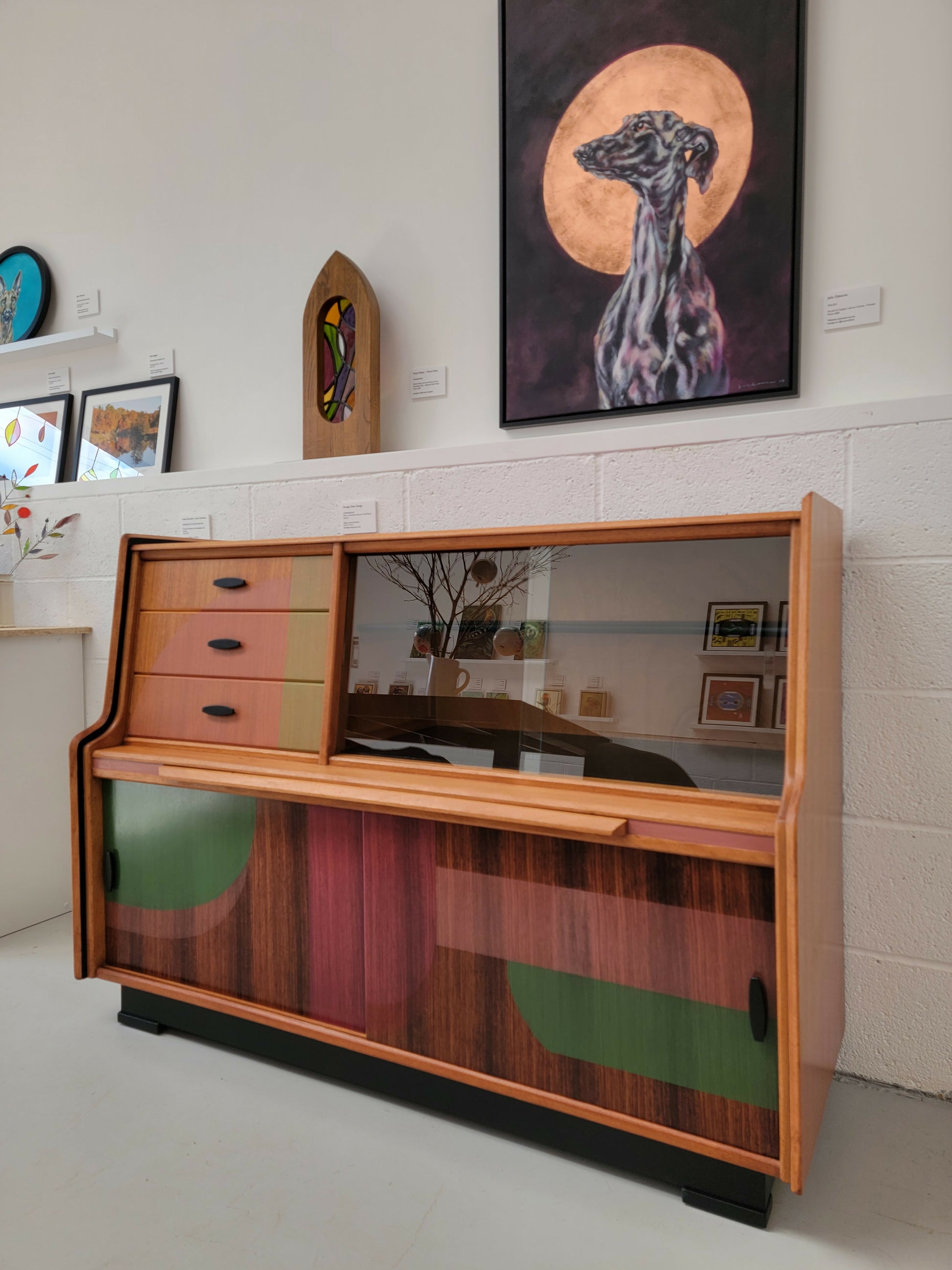 Orange Otter teak sideboard in gallery